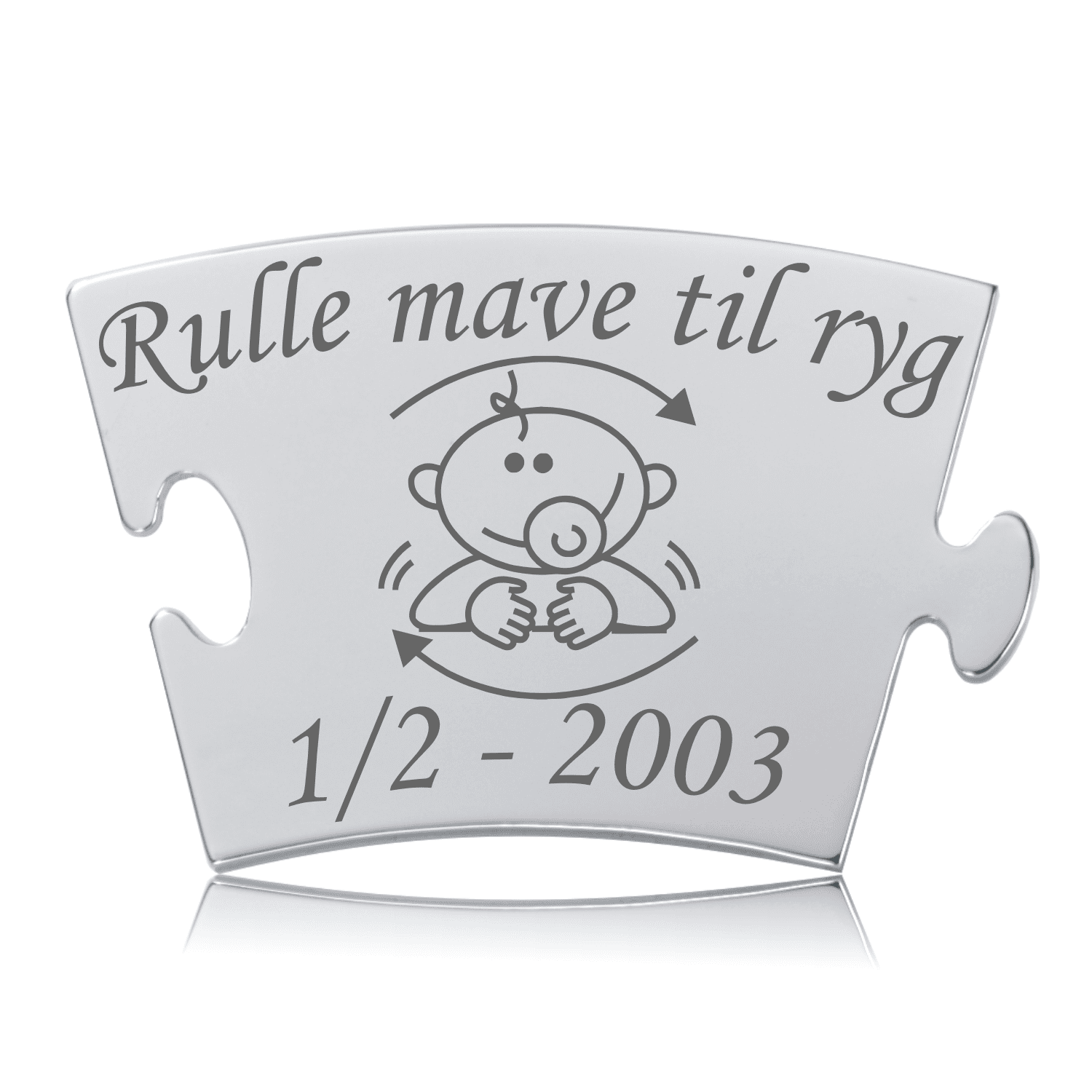 Memozz Classic brik i rustfrit stål med teksten "Rulle mave til ryg" og en stregtegning af en baby