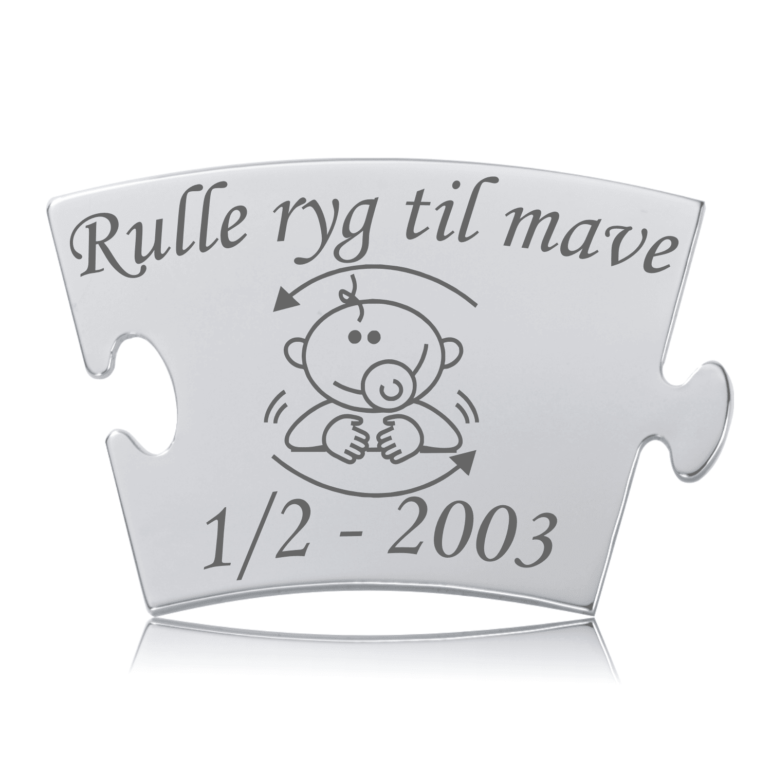 Memozz Classic brik i rustfrit stål med teksten "Rulle ryg til mave" og et motiv af en baby med sut