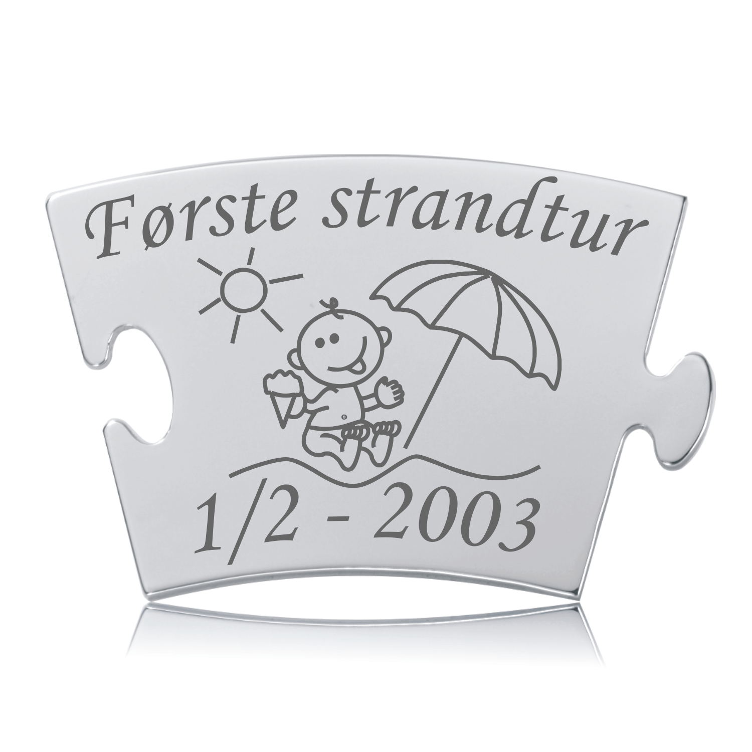 Memozz Classic brik "Første strandtur" i blankpoleret stål med gravering af strandmotiv og baby