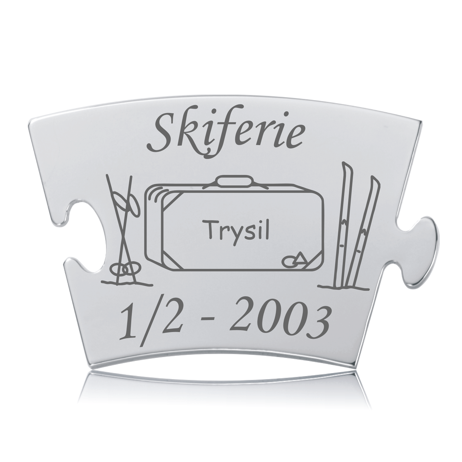 Memozz Classic brik i rustfrit stål med gravering af ski, skistave, kuffert og teksten "Skiferie Trysil"