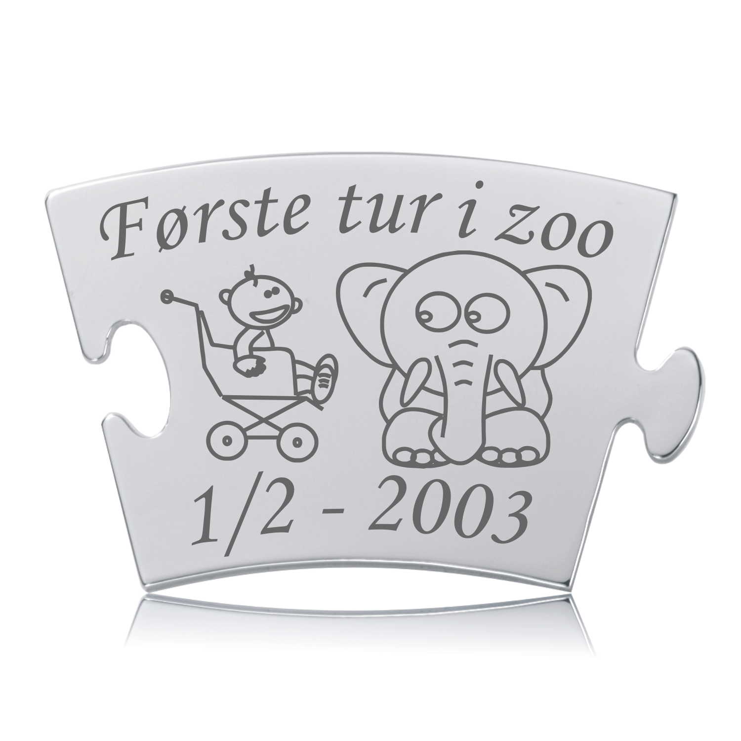 Blankpoleret Memozz Classic brik “Første tur i zoo” med lasergraverede motiver af et spædbarn i klapvogn og en elefant.