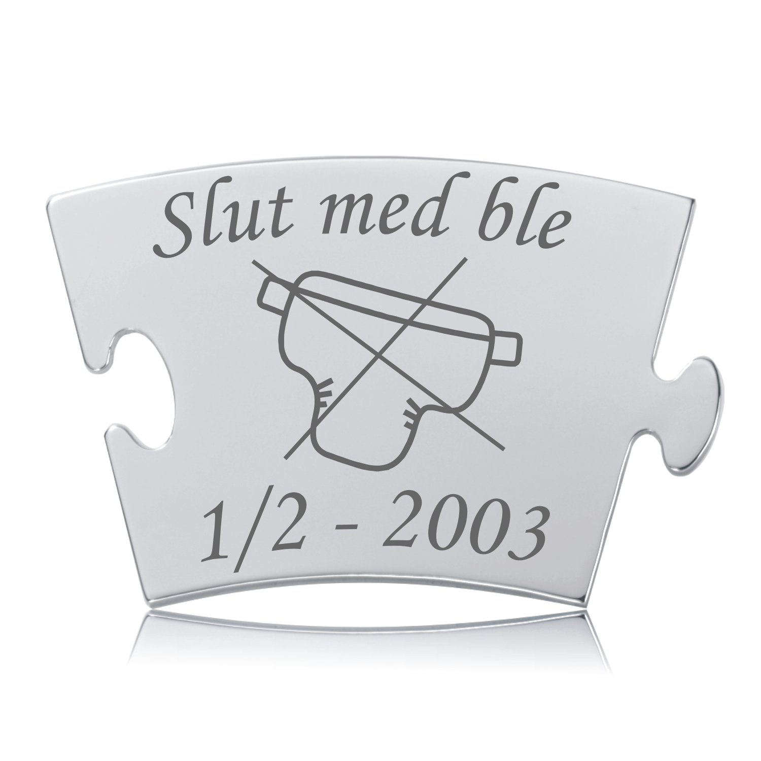 Memozz Classic brik i håndpoleret rustfrit stål med teksten "Slut med ble" og et grafisk symbol af en overstreget ble.