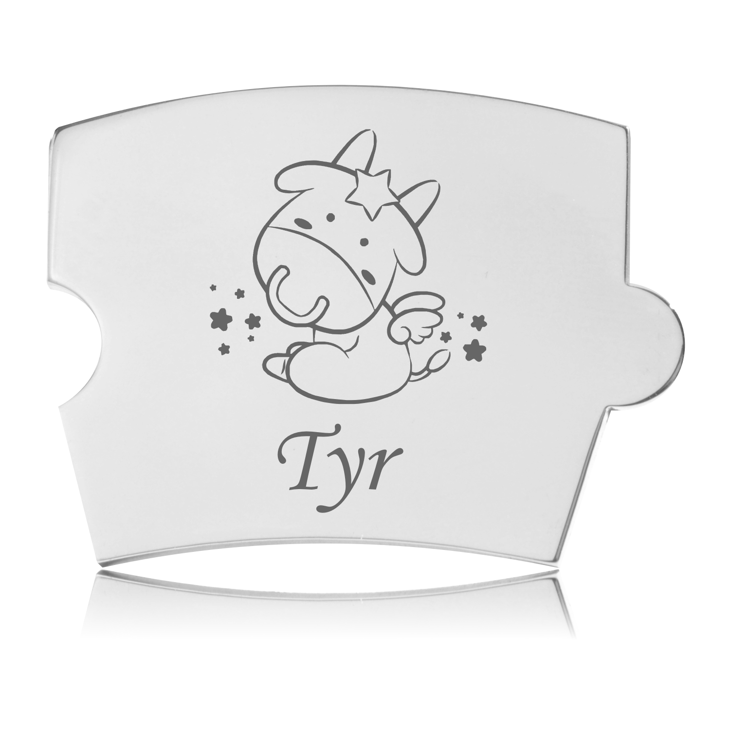 Memozz Spin brik med lasergraveret motiv af stjernetegnet Tyr, en nuttet tyr med stjerne og vinger, i rustfrit stål på hvid baggrund.