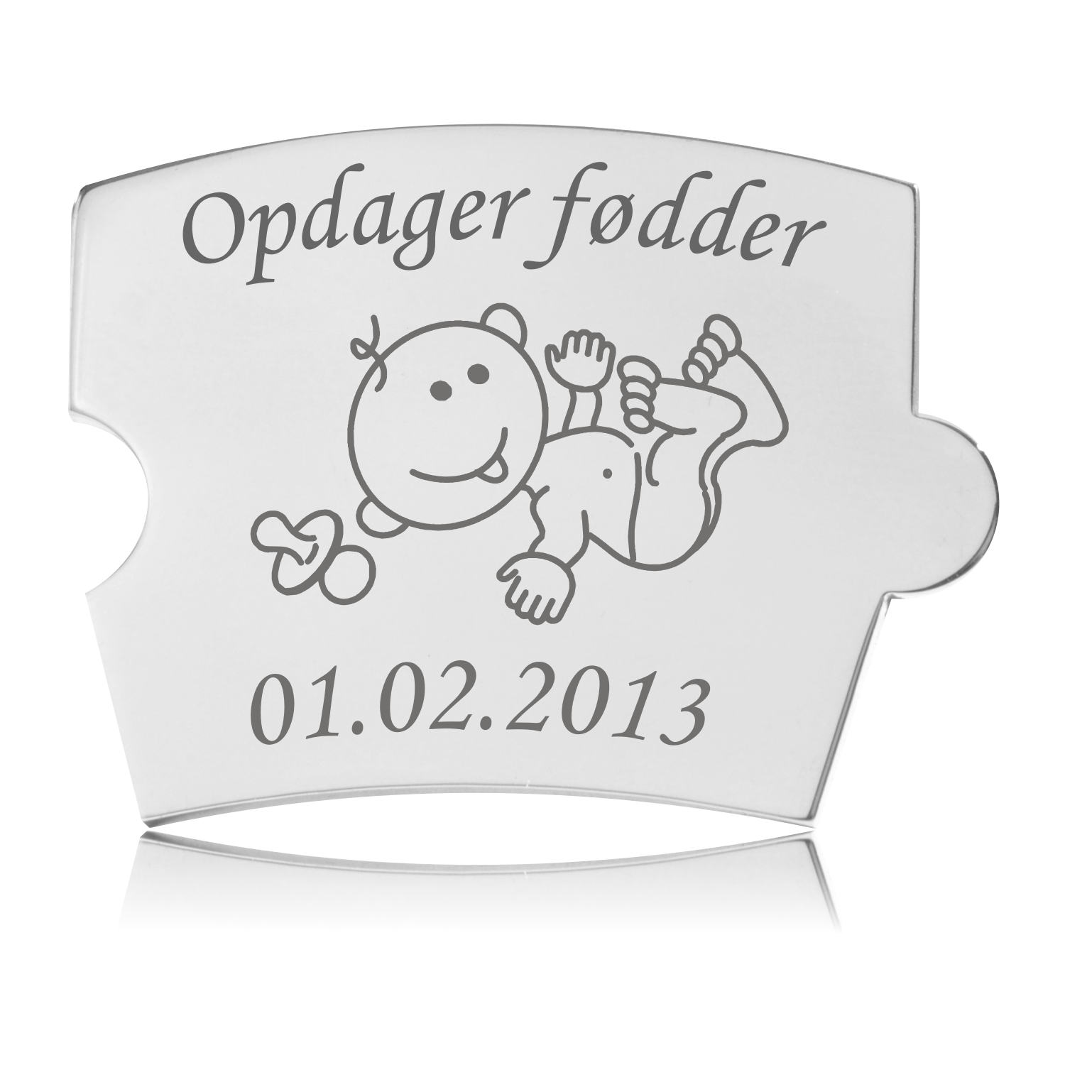 Memozz Spin brik i håndpoleret rustfrit stål, graveret med en glad baby og teksten "Opdager fødder".
