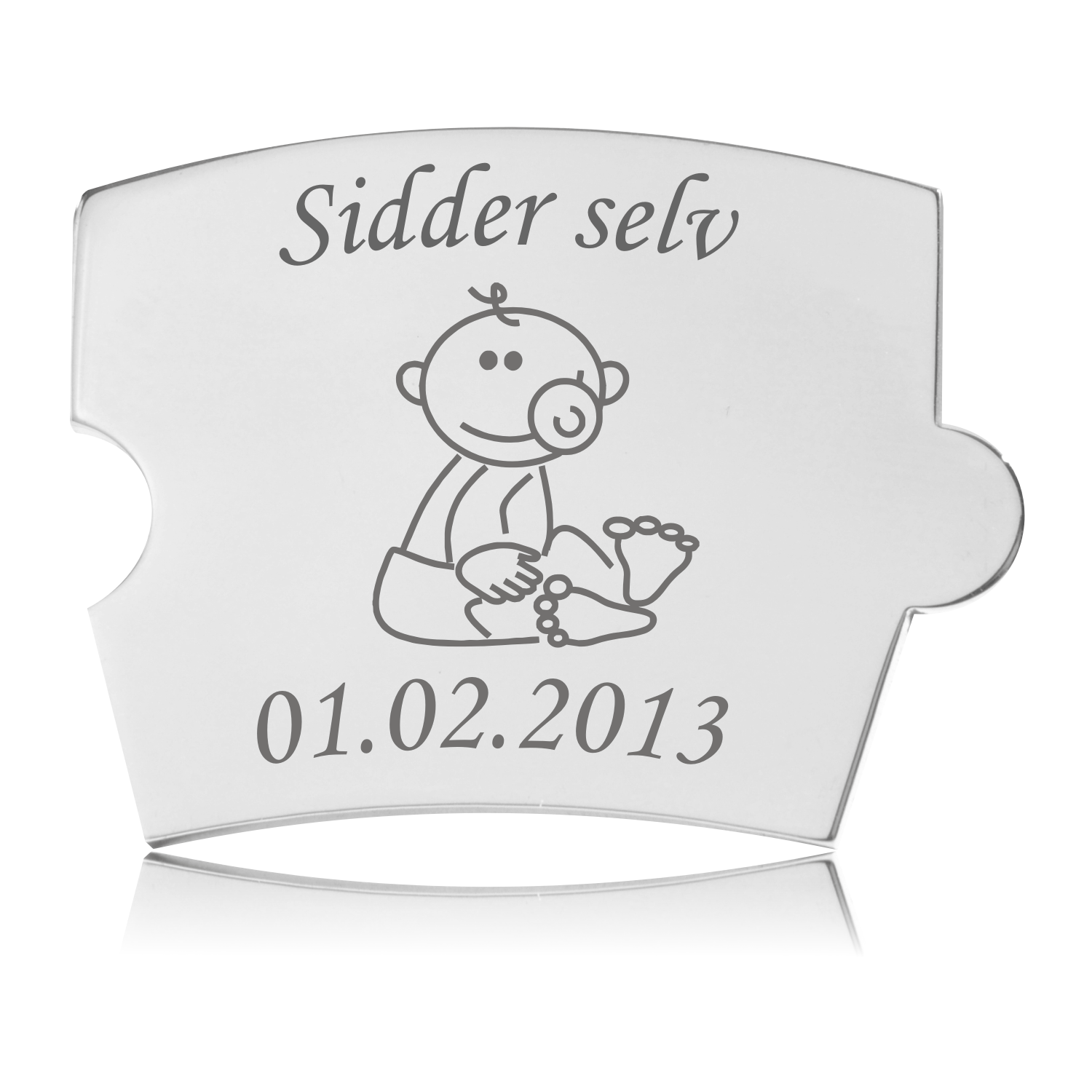 Blankpoleret Memozz Spin brik til baby med teksten "Sidder selv" og tegning af siddende baby med sut.