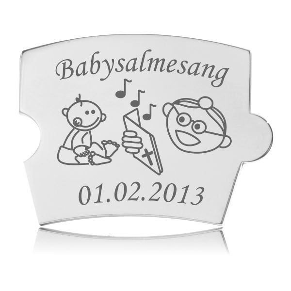 Memozz Spin brik i stål til minde om babysalmesang. Brikken har en gravering af en baby, noder og tekst.