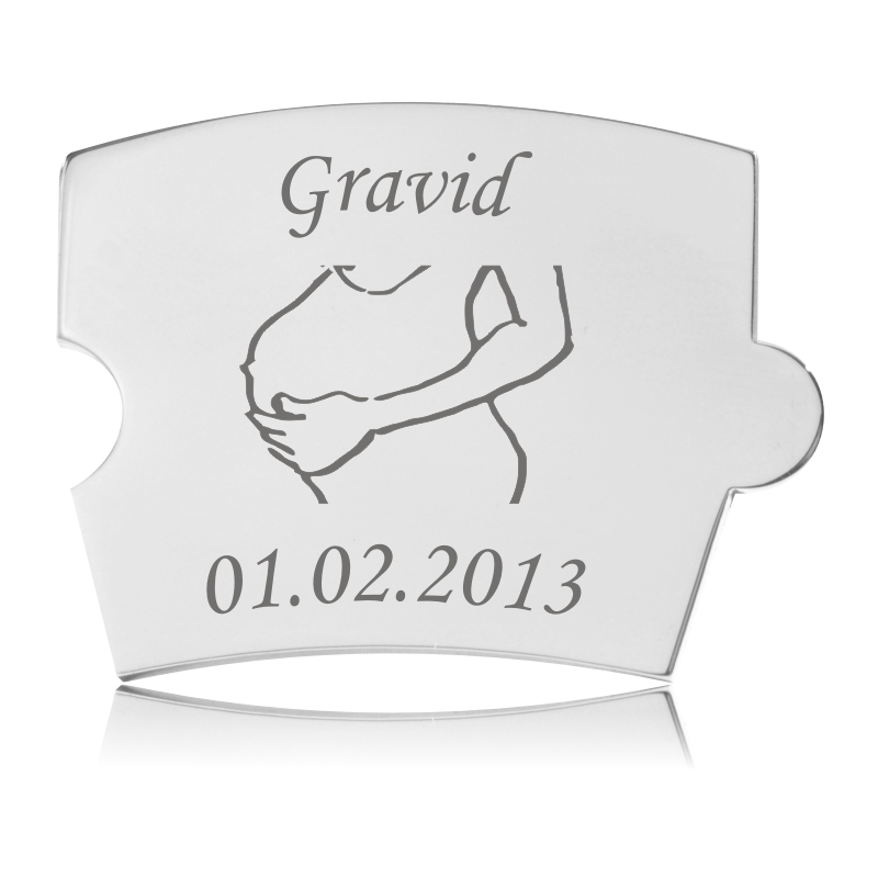 Memozz Spin Gravid Mave brik i håndpoleret rustfrit stål med lasergravering af "Gravid" og kontur af kvindemave