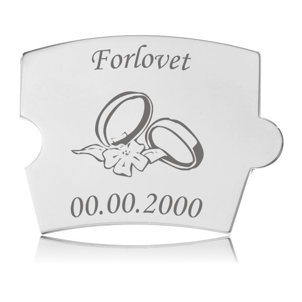Spin Forlovet Brik Blomst Graveret Memozz Spin Forlovet brik i poleret rustfrit stål med gravering af teksten "Forlovet", to vielsesringe og en blomst samt en dato.